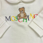 MOSCHINO tutina tinta unita con stampa Bianco per Neonato MMY06Z BIANCO MOSCHINO