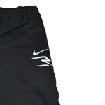 Nike Pantalone Tuta tinta unita con Logo Nero per Bambino 9Q0321 NERO NIKE 